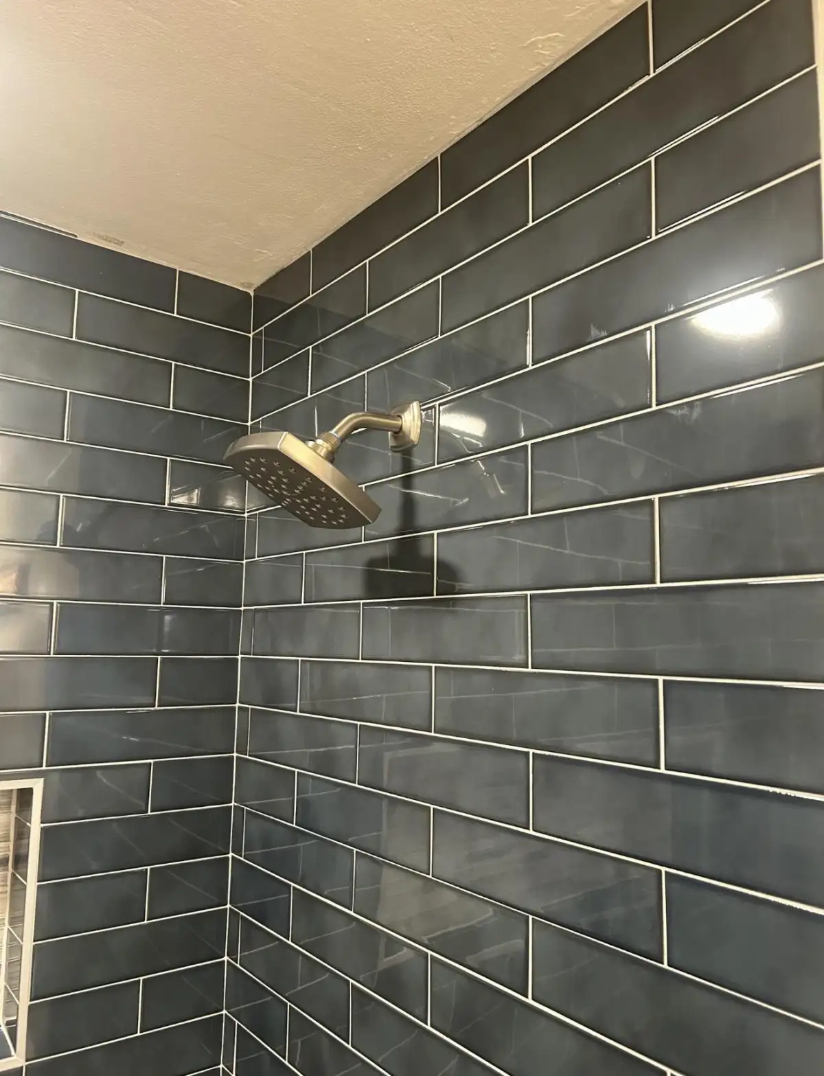 Decorative accent wall tile installation in DFW bathroom