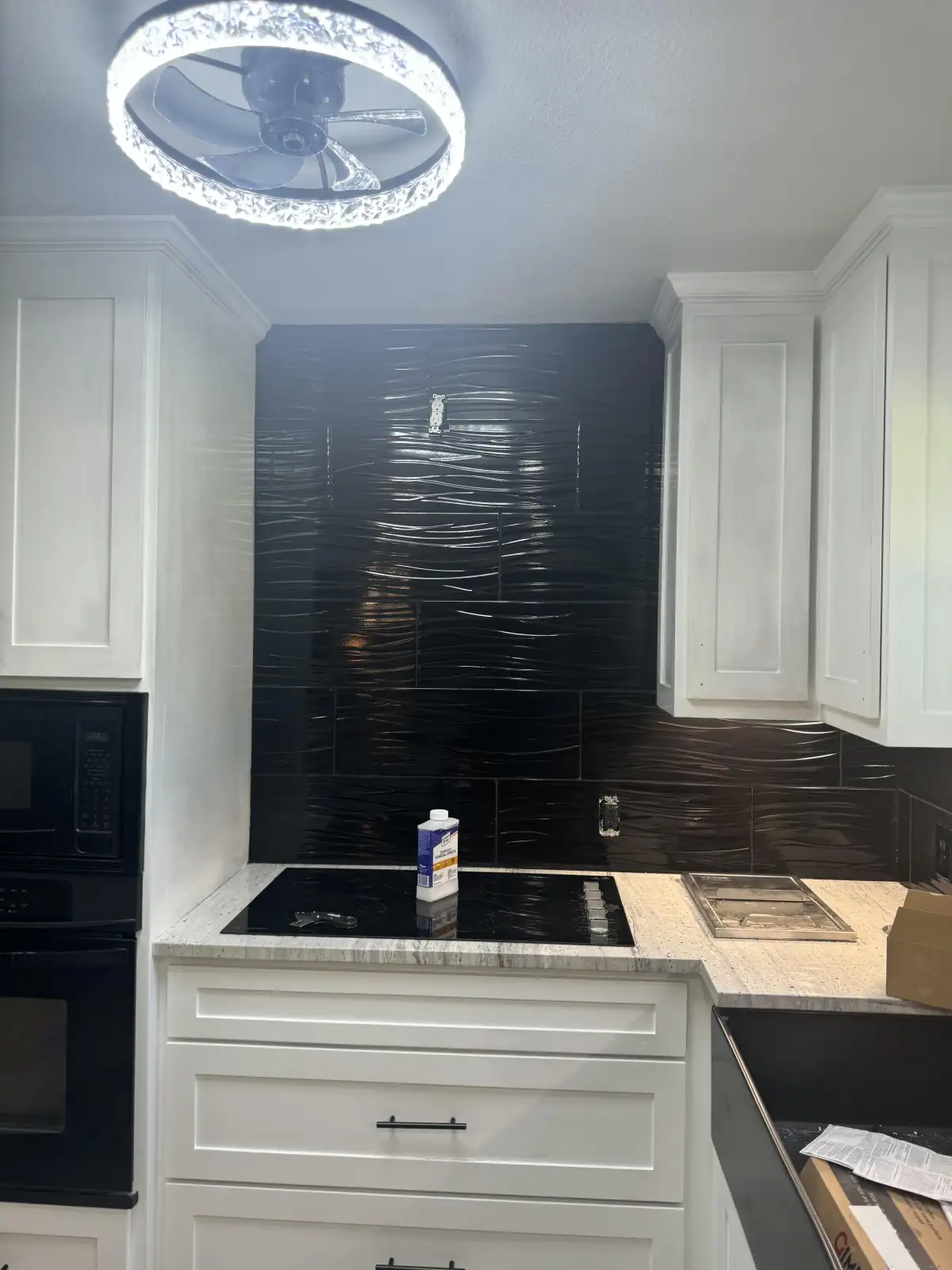 White subway tile backsplash installation in Arlington home