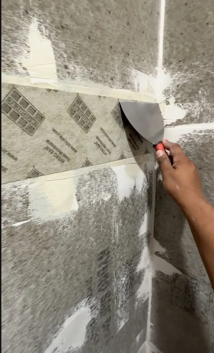 Bathroom shower waterproofing membrane installed before tile work in a DFW remodel