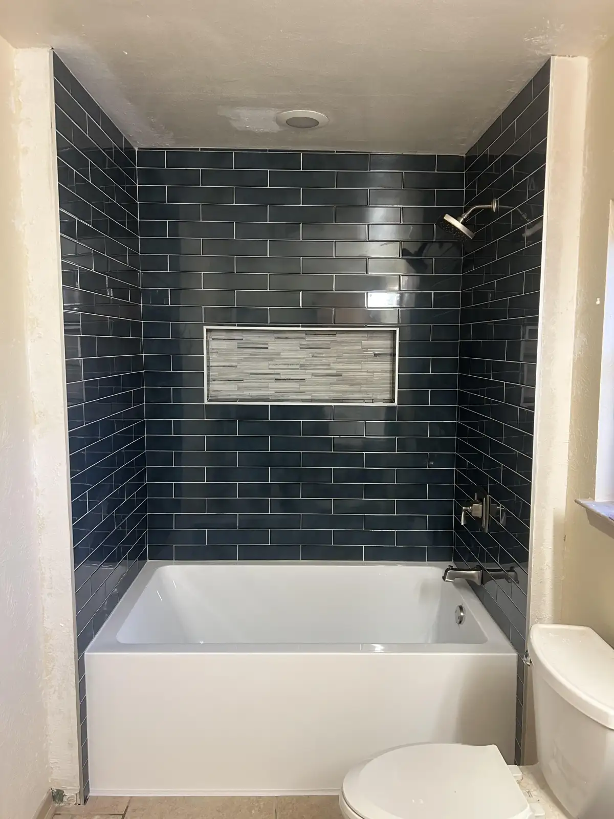 Custom tile walk-in shower replacing bathtub in Fort Worth master bathroom