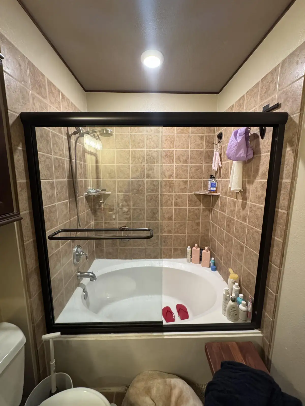 Walk-in shower with custom mosaic floor tile in DFW